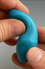 Blue clay being shaped